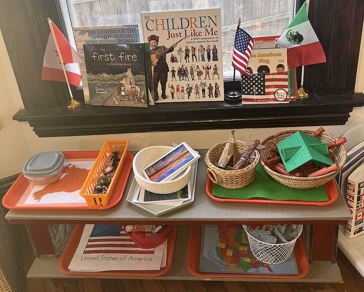 shelf with Montessori geography materials on trays