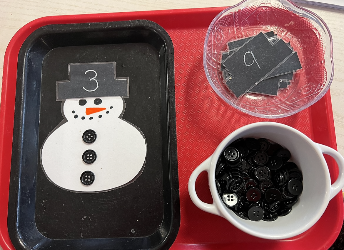 snowman with button counters on tray